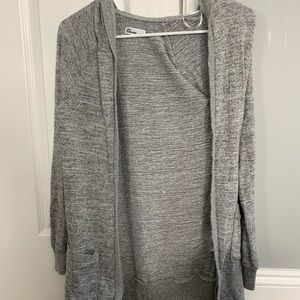 Grey cardigan with pockets and a hood